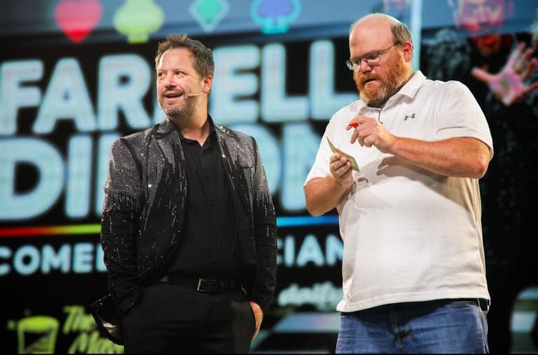 Farrell Dillon with a laughing audience volunteer